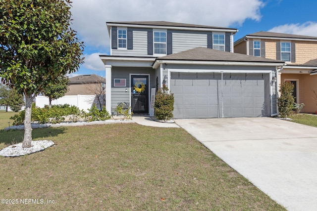 traditional home with a front yard, fence, driveway, and an attached garage