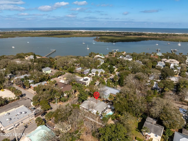 birds eye view of property with a water view and a residential view