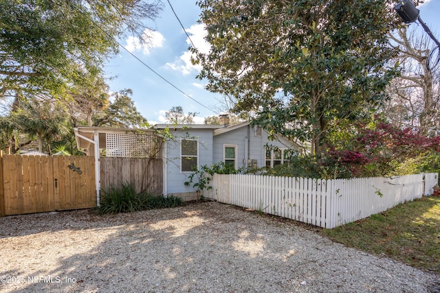 view of side of property with fence