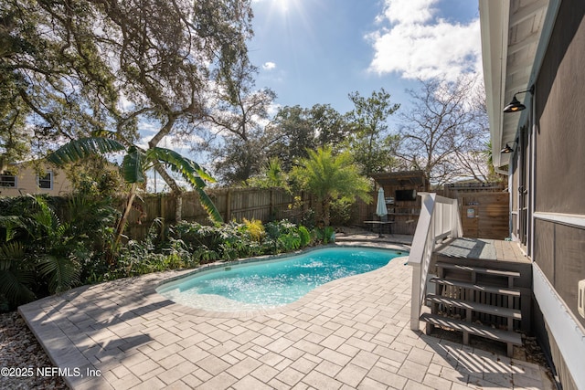 view of pool with a fenced in pool, a fenced backyard, and a patio