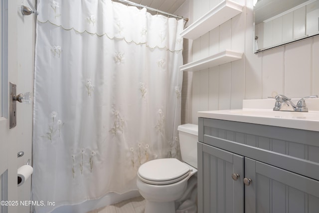 full bathroom with toilet, curtained shower, and vanity