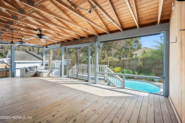 wooden terrace with a fenced in pool, outdoor lounge area, fence, and a ceiling fan