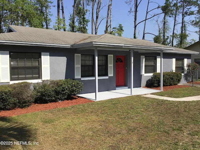 view of front of house with a porch, a front yard, and stucco siding