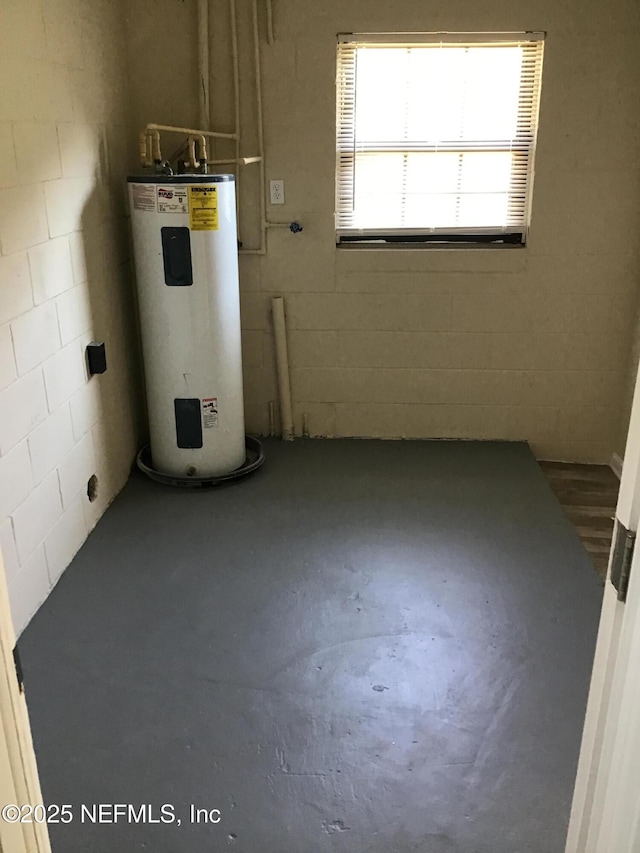 utility room featuring water heater