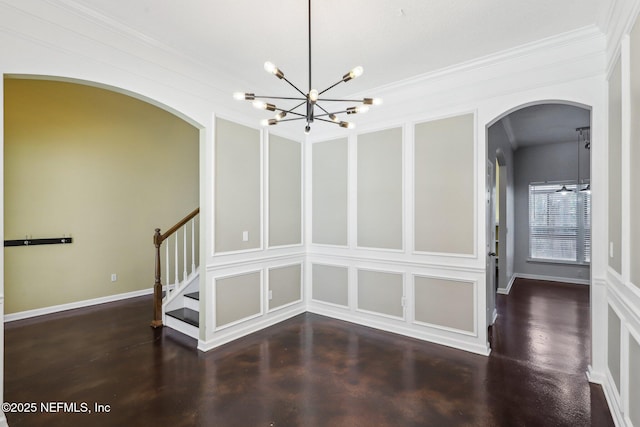 interior space featuring stairs, a chandelier, and a decorative wall