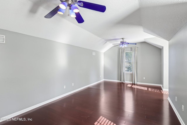 bonus room featuring vaulted ceiling, baseboards, and wood finished floors