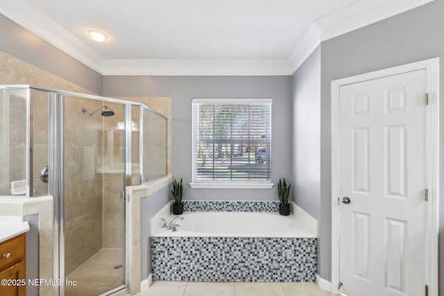 bathroom with a shower stall, ornamental molding, a bath, and vanity