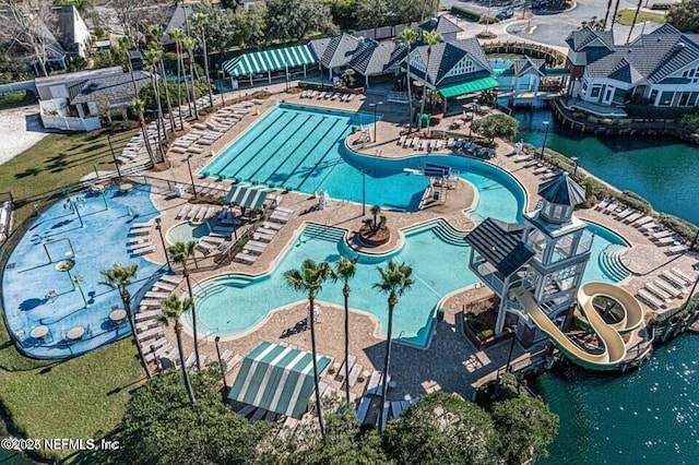 birds eye view of property with a water view