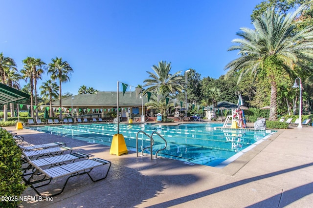 community pool with a patio area