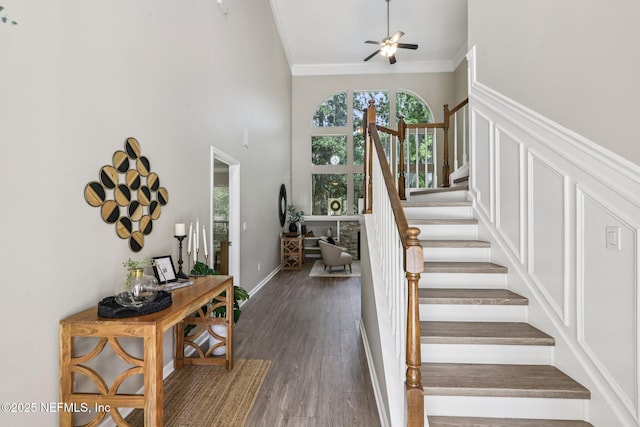1494 Walnut Creek Dr, Fleming Island, FL 32003 - stairs featuring ornamental molding, wood finished floors, ceiling fan, and a towering ceiling