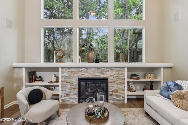 1494 Walnut Creek Dr, Fleming Island, FL 32003 - living area featuring wood finished floors, a towering ceiling, and a fireplace