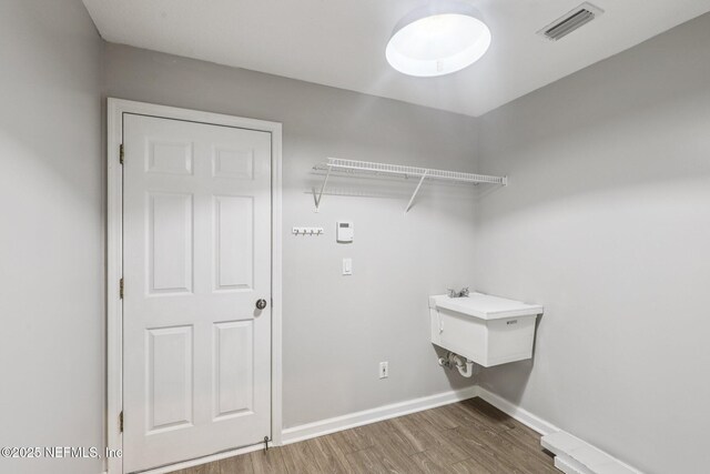 1494 Walnut Creek Dr, Fleming Island, FL 32003 - washroom featuring wood finished floors and baseboards