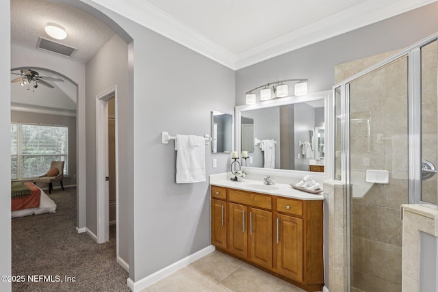 1494 Walnut Creek Dr, Fleming Island, FL 32003 - bathroom with vanity, a stall shower, ornamental molding, ceiling fan, and connected bathroom