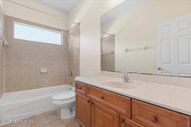 full bath featuring shower / bathing tub combination, tile patterned flooring, vanity, and toilet