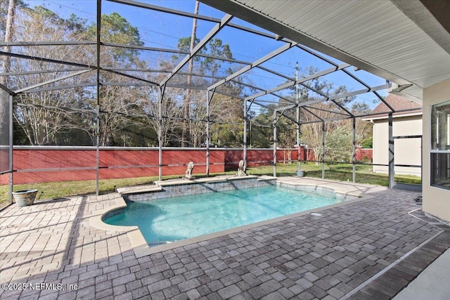 outdoor pool featuring a lanai and a patio area