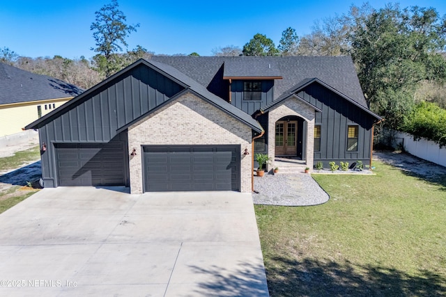 modern inspired farmhouse featuring driveway, an attached garage, a front lawn, board and batten siding, and brick siding