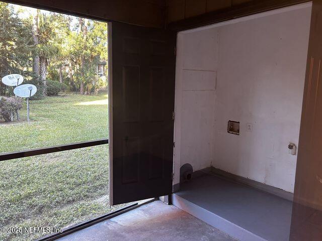 doorway with concrete floors