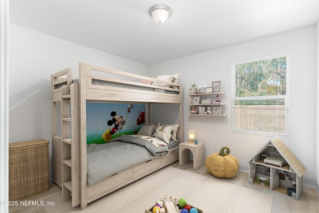 bedroom featuring wood finished floors