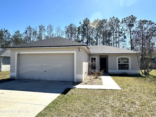 ranch-style house with an attached garage, a shingled roof, driveway, stucco siding, and a front yard