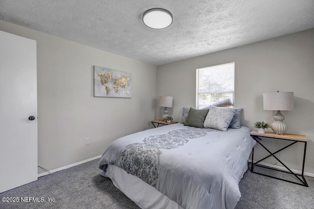 carpeted bedroom with baseboards and a textured ceiling