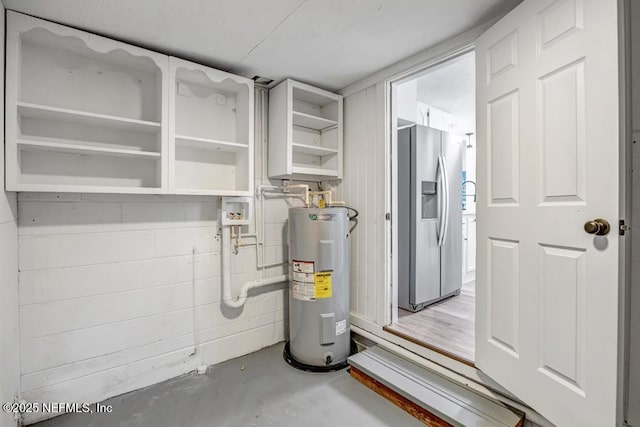 utility room featuring electric water heater