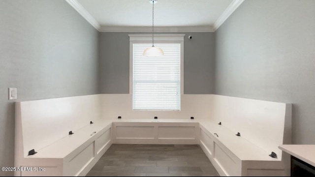 bathroom featuring wood finished floors and crown molding