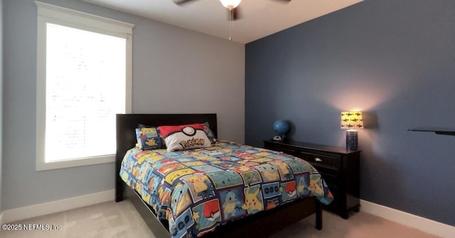 bedroom with carpet, ceiling fan, and baseboards