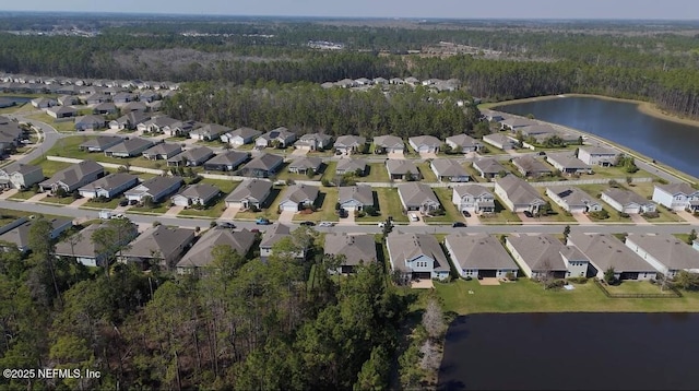 aerial view featuring a water view and a residential view