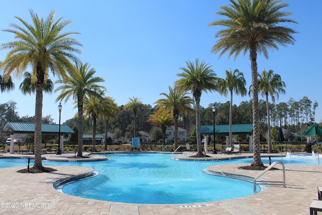 community pool featuring a patio area