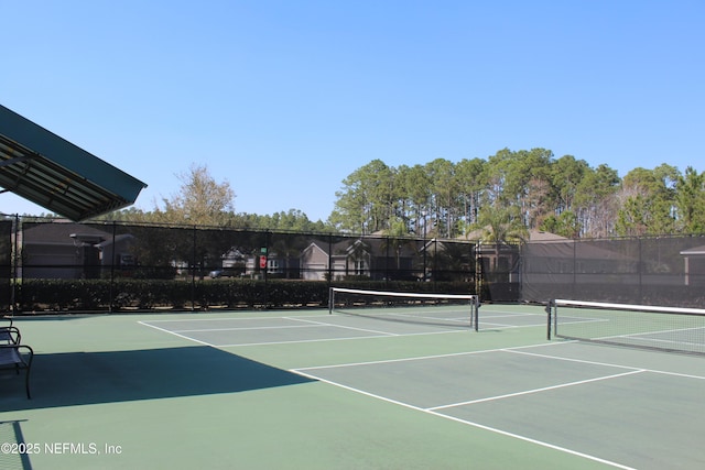 view of sport court featuring community basketball court and fence