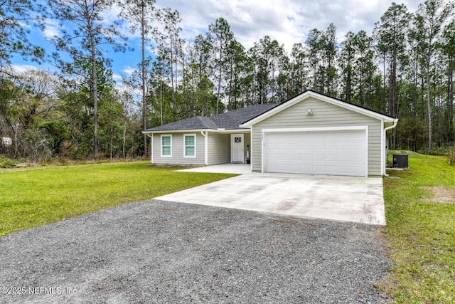 ranch-style house with driveway, an attached garage, and a front lawn