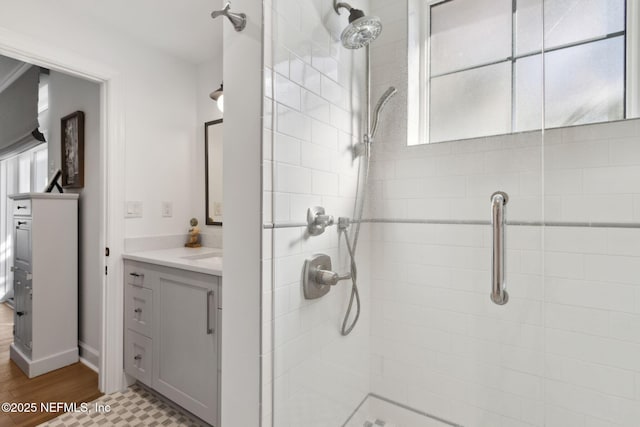 bathroom featuring a stall shower and vanity