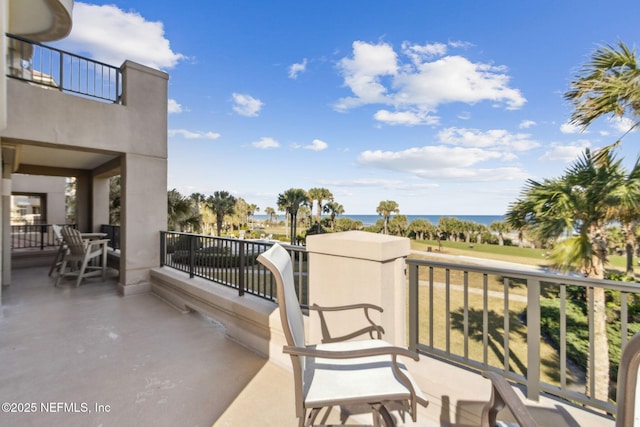 balcony featuring a water view