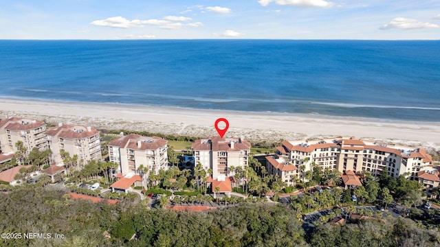 aerial view featuring a water view and a beach view