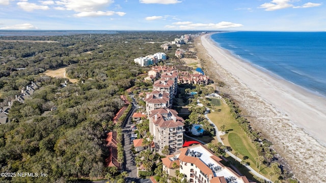 drone / aerial view featuring a beach view and a water view