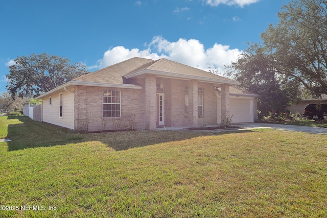 view of front facade featuring an attached garage, a front lawn, concrete driveway, and brick siding