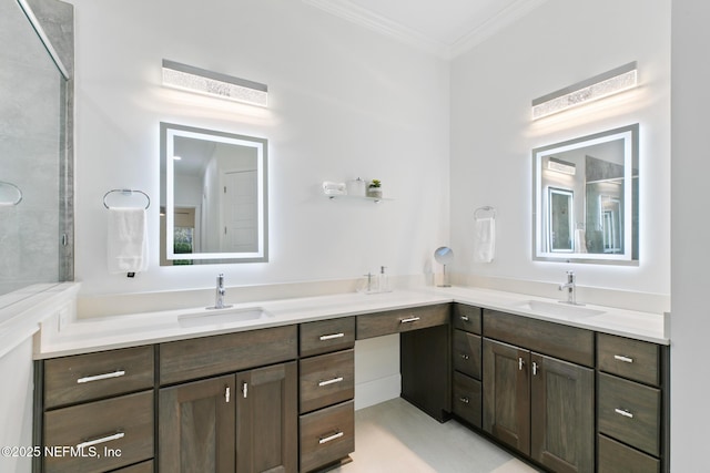 full bath featuring double vanity, a sink, and crown molding