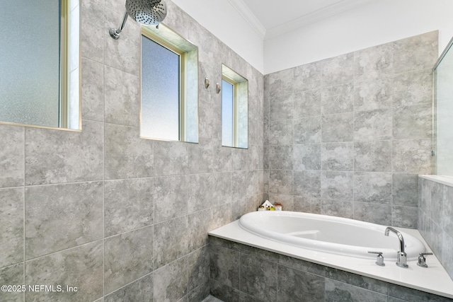 bathroom with a garden tub and crown molding