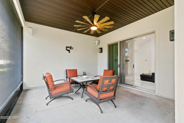 view of patio / terrace with outdoor dining area and a ceiling fan