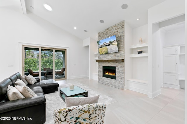 living room featuring baseboards, high vaulted ceiling, a fireplace, and built in features