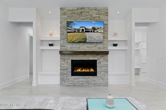 unfurnished living room with baseboards, a fireplace, built in features, and recessed lighting