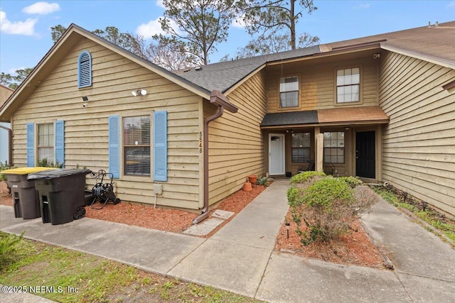 view of front of home with roof with shingles