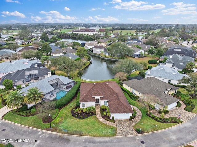 aerial view featuring a water view and a residential view