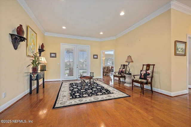 entryway with baseboards, french doors, wood finished floors, and crown molding