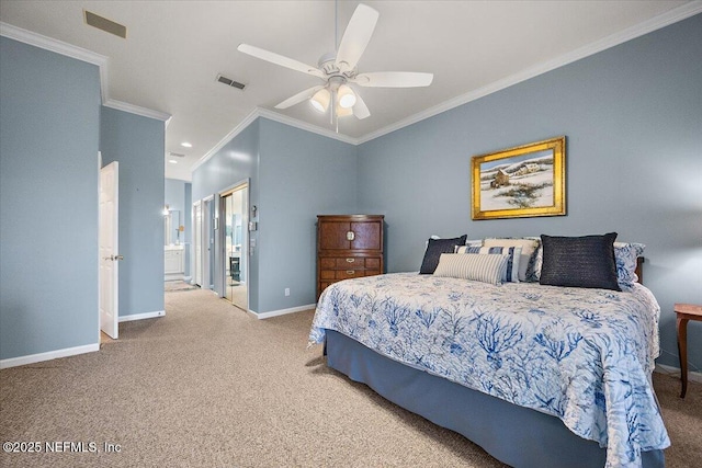 carpeted bedroom with crown molding, visible vents, a ceiling fan, ensuite bath, and baseboards