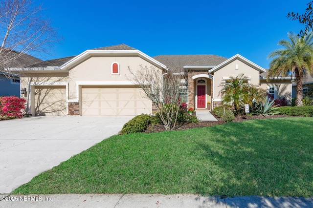 single story home featuring a garage, concrete driveway, stone siding, a front lawn, and stucco siding