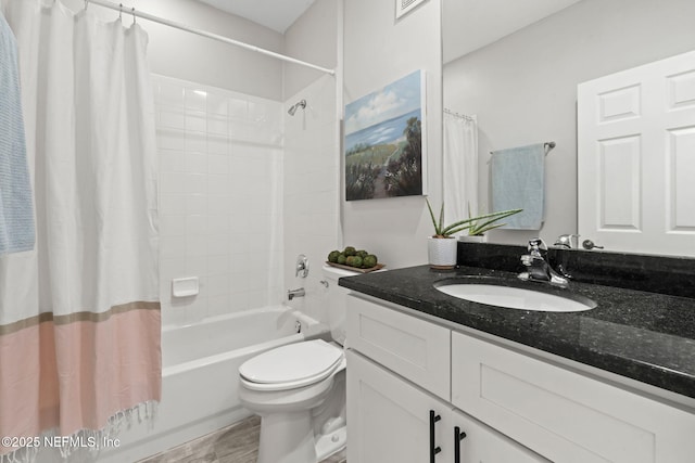 full bathroom featuring toilet, shower / bath combo, wood finished floors, and vanity