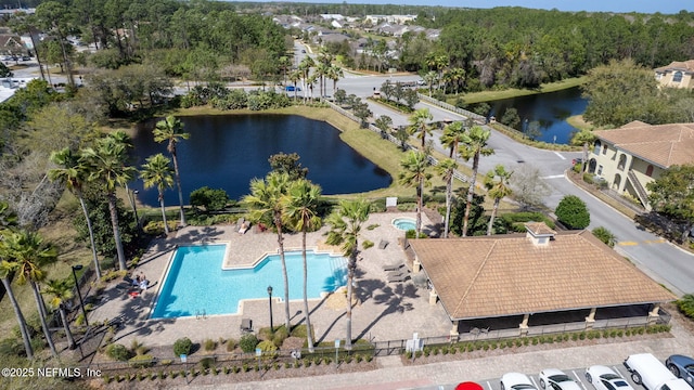 birds eye view of property featuring a water view