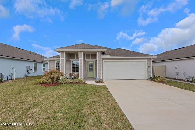 prairie-style home featuring a garage, concrete driveway, and a front lawn