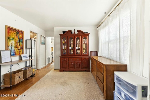 sitting room with light wood-style floors